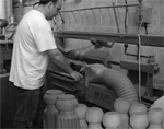 A snooker table leg being turned on the lathe