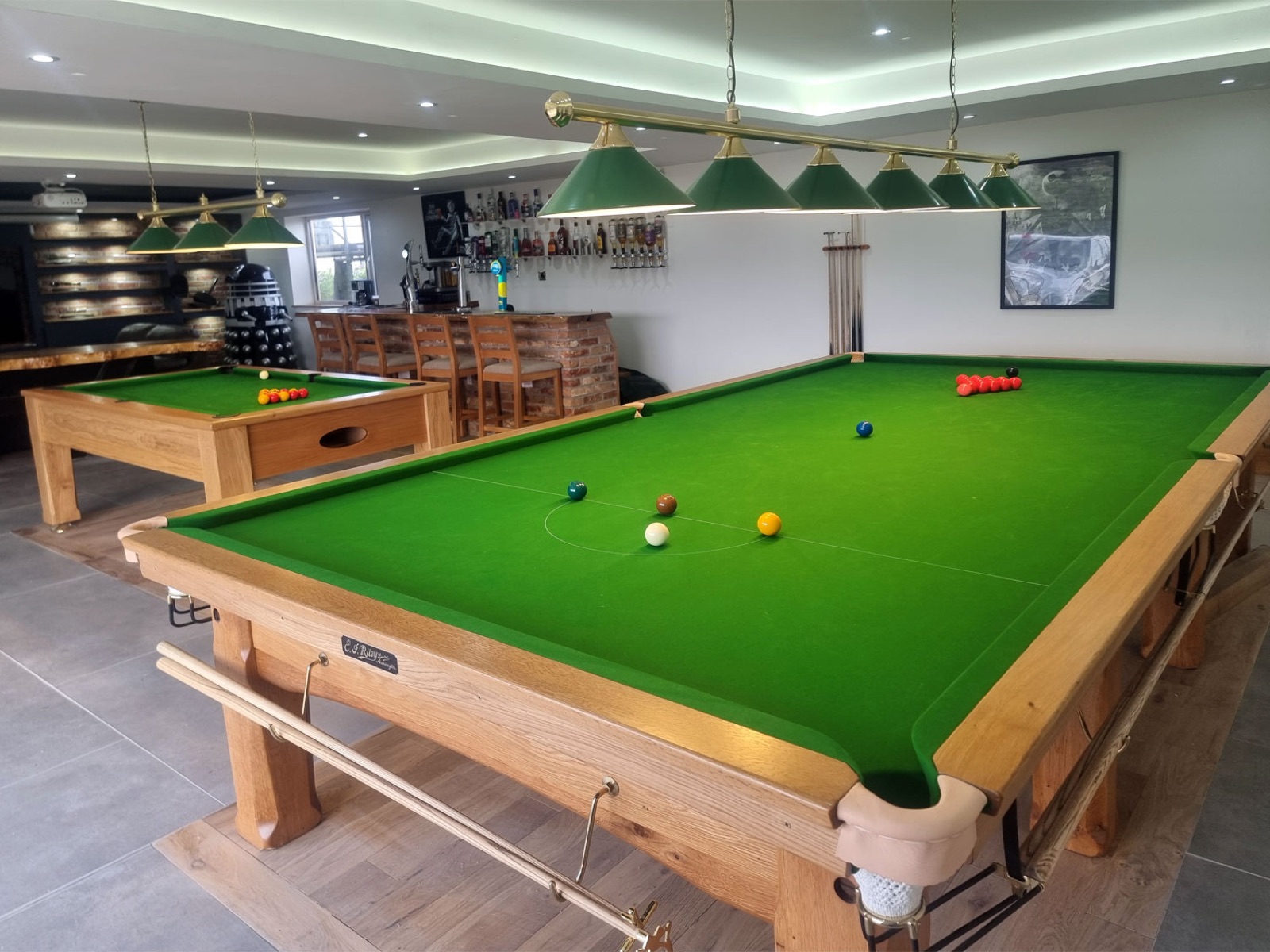 12ft Riley oak Imperial snooker table installed beside a 7ft Balmoral pool table in a games room